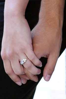 23 small diamonds, and one bigger diamond... I LOVE IT. Lets see some rings my fellow brides.