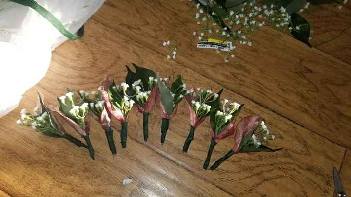 Boutineers, sign for table, and photo area