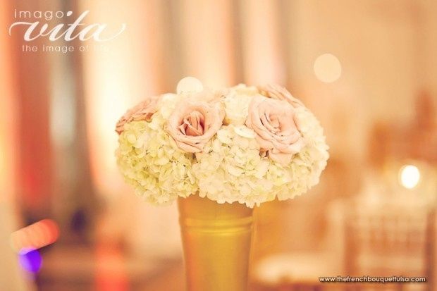 My wedding color is gold with champagne. What color of flowers should I get???