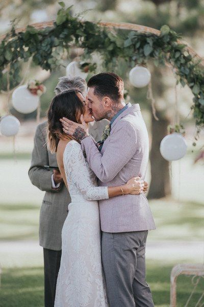 Ceremony kiss outdoor venue with arch