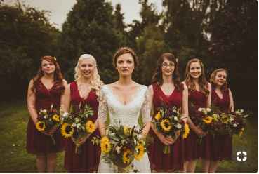 Burgundy dresses with sunflower bouquets