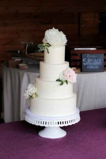 Classic White Multi-tiered wedding cake with buttercream frosting