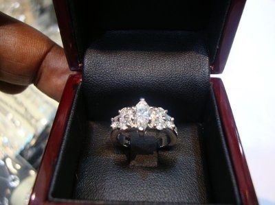 23 small diamonds, and one bigger diamond... I LOVE IT. Lets see some rings my fellow brides.