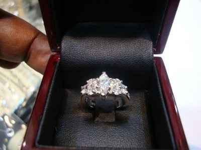 23 small diamonds, and one bigger diamond... I LOVE IT. Lets see some rings my fellow brides.