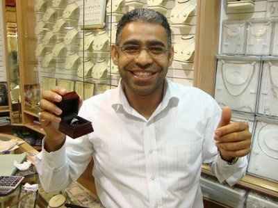 23 small diamonds, and one bigger diamond... I LOVE IT. Lets see some rings my fellow brides.