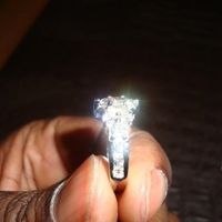 23 small diamonds, and one bigger diamond... I LOVE IT. Lets see some rings my fellow brides.