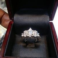 23 small diamonds, and one bigger diamond... I LOVE IT. Lets see some rings my fellow brides.