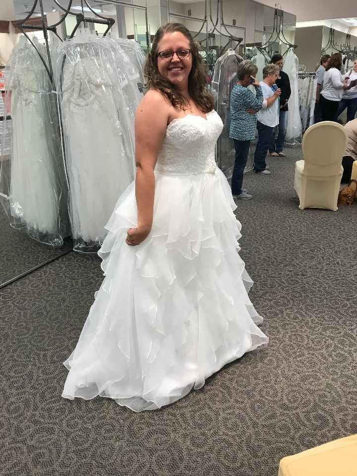This was the first wedding dress I tried on so I cried. Thought the bottom was so fun... ended up re