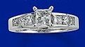 23 small diamonds, and one bigger diamond... I LOVE IT. Lets see some rings my fellow brides.