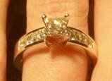 23 small diamonds, and one bigger diamond... I LOVE IT. Lets see some rings my fellow brides.
