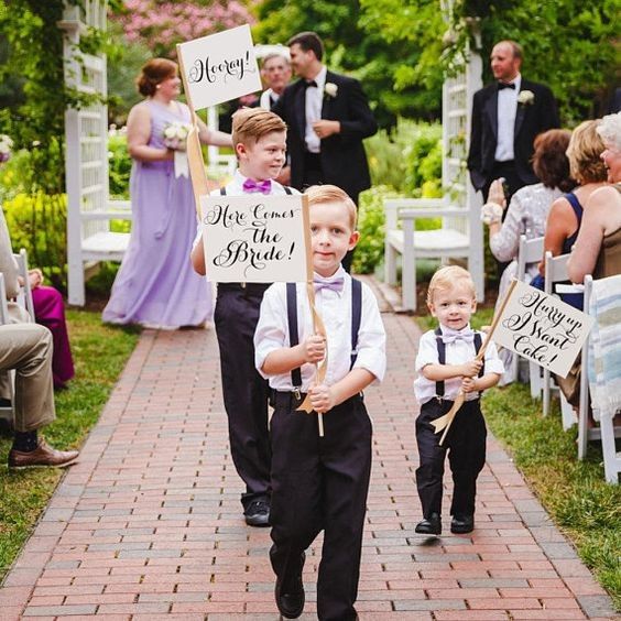 children in ceremony with signs 