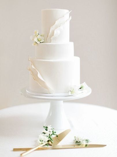 white wedding cake on cake stand