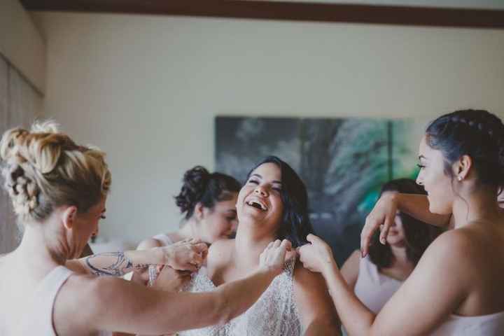 bride trying on wedding dress bridesmaids laughing friendship friends family
