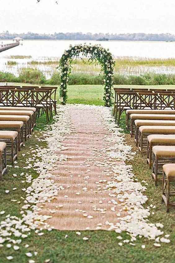 burlap aisle runner outdoor wedding ceremony petals scattered 