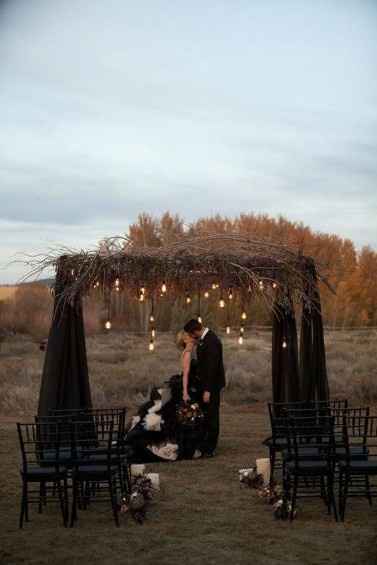 black arch ceremony outdoor wedding