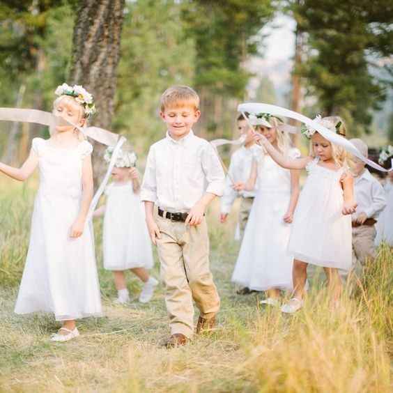 children in ceremony with ribbons