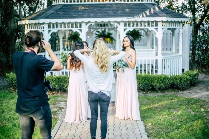 photographers at work with a wedding party, two shooters