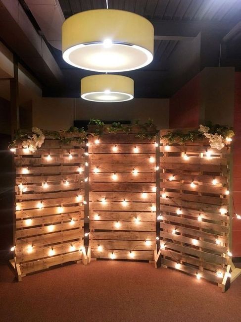 wedding backdrop with pallets and lights