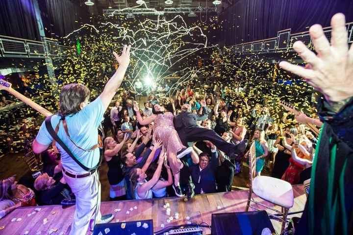 wedding reception party, couple stage diving