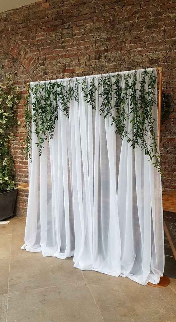 wedding backdrop with pipping, draping and greenery