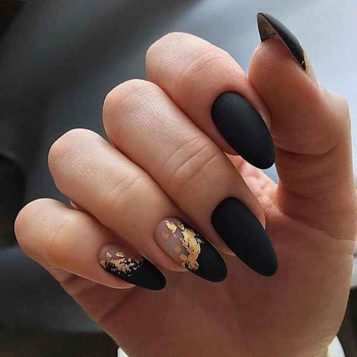 black manicure with gold foil