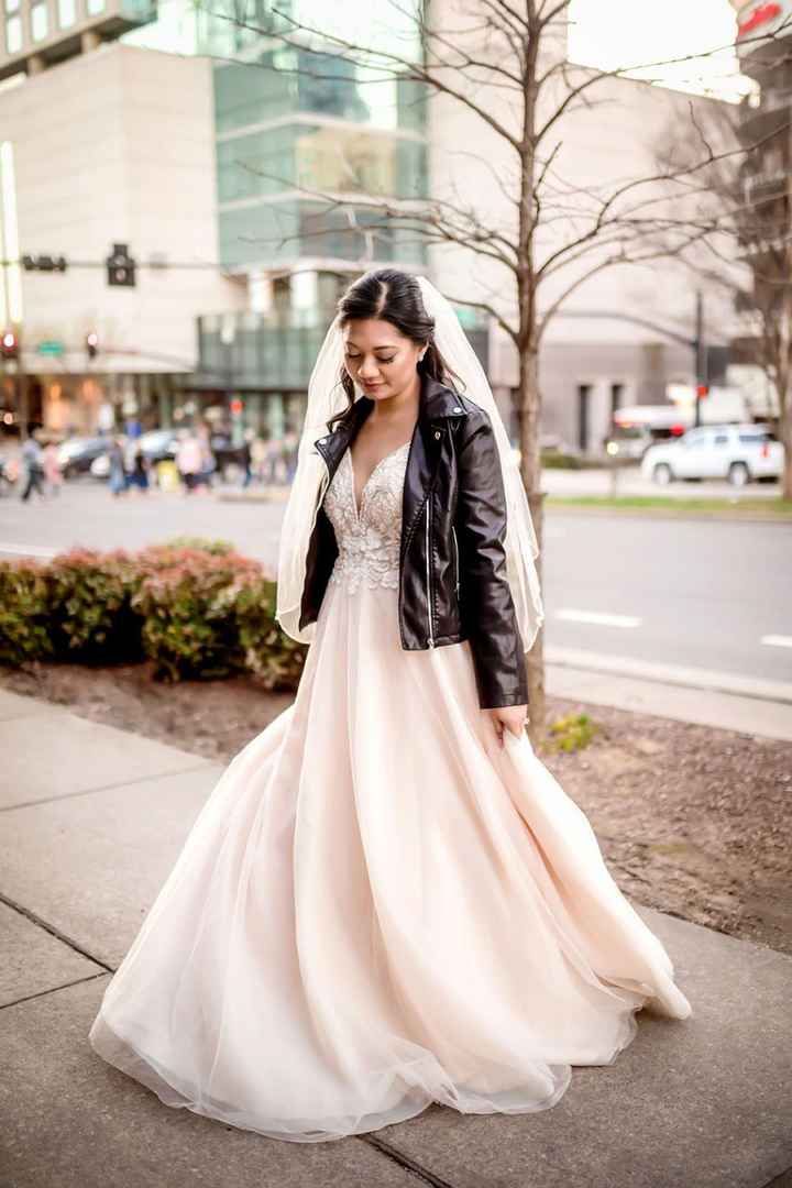 black leather wedding jacket with a blush wedding dress