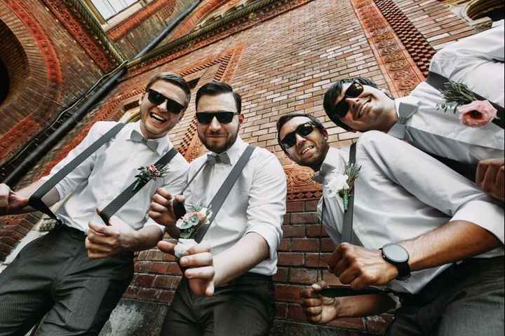 groomsmen, bowtie and suspenders with boutonnieres