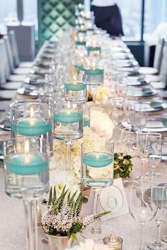 tiffany blue candles in wedding centrepiece 