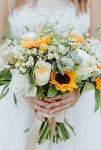 roses, white roses, sunflowers, daisies and babys breath bridal bouquet