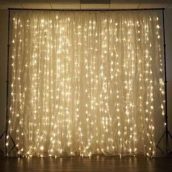 wedding backdrop with drapery and lights