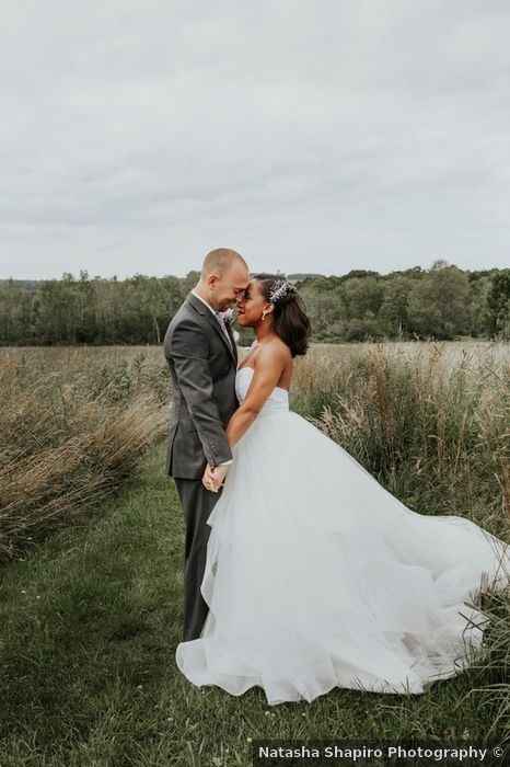 full wedding dress, bride and groom in a field