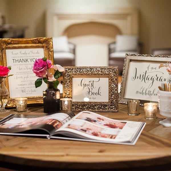 guest book table with signs