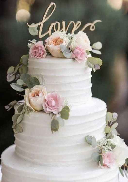 butter cream cake with rose design and love topper