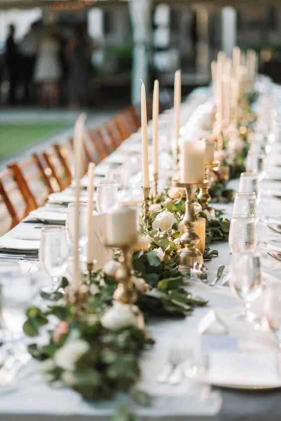 candle stock with greenery and roses centerpiece