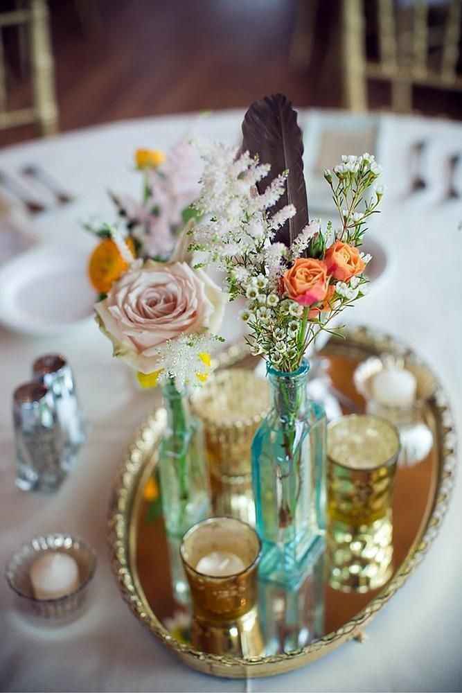 wedding centrepiece with gold tray, flowers vases and flowers