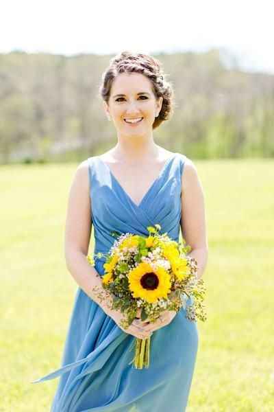 blue bridesmaid dresses with sunflower bouquet 