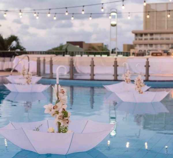 wedding decor for a pool, upside down umbrellas 