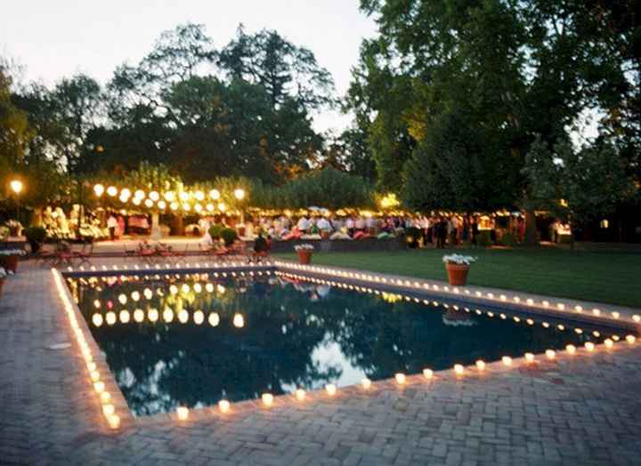 wedding pool outlined with candles