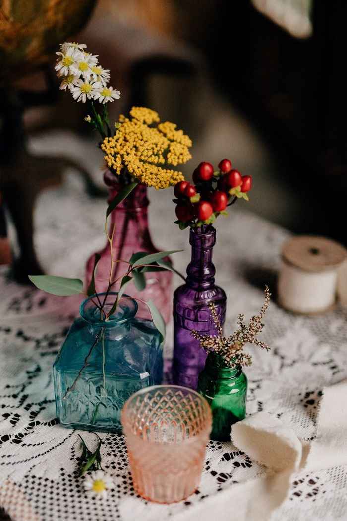 jewel tone vases with flowers, wedding centrepiece