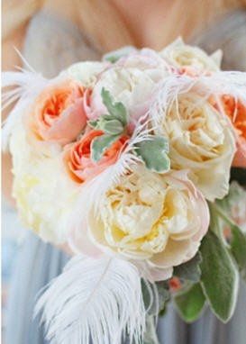 what flowers for black bridesmaids dresses with orange shawls?