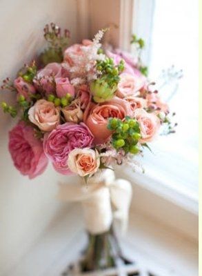 what flowers for black bridesmaids dresses with orange shawls?