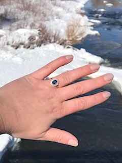 Mine is a Montana sapphire surrounded by diamonds in a rose gold setting 