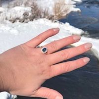 Mine is a Montana sapphire surrounded by diamonds in a rose gold setting 