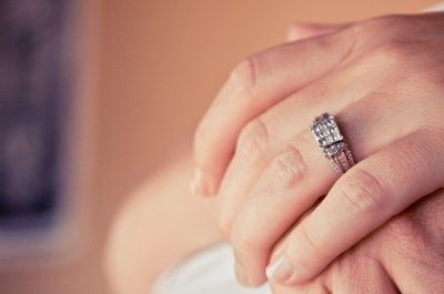 23 small diamonds, and one bigger diamond... I LOVE IT. Lets see some rings my fellow brides.