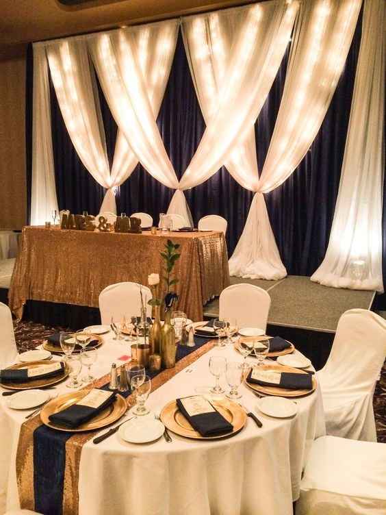 Black white and gold tables and backdrop