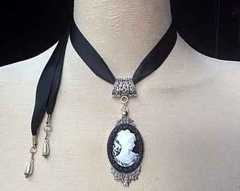 Black ribbon with black and white cameo