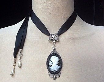 Black ribbon with black and white cameo