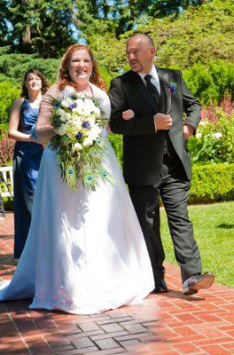 Almost 2 months later and we got our wedding photos.  (Pics included)
