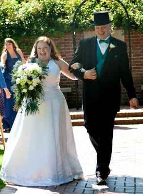 Almost 2 months later and we got our wedding photos.  (Pics included)