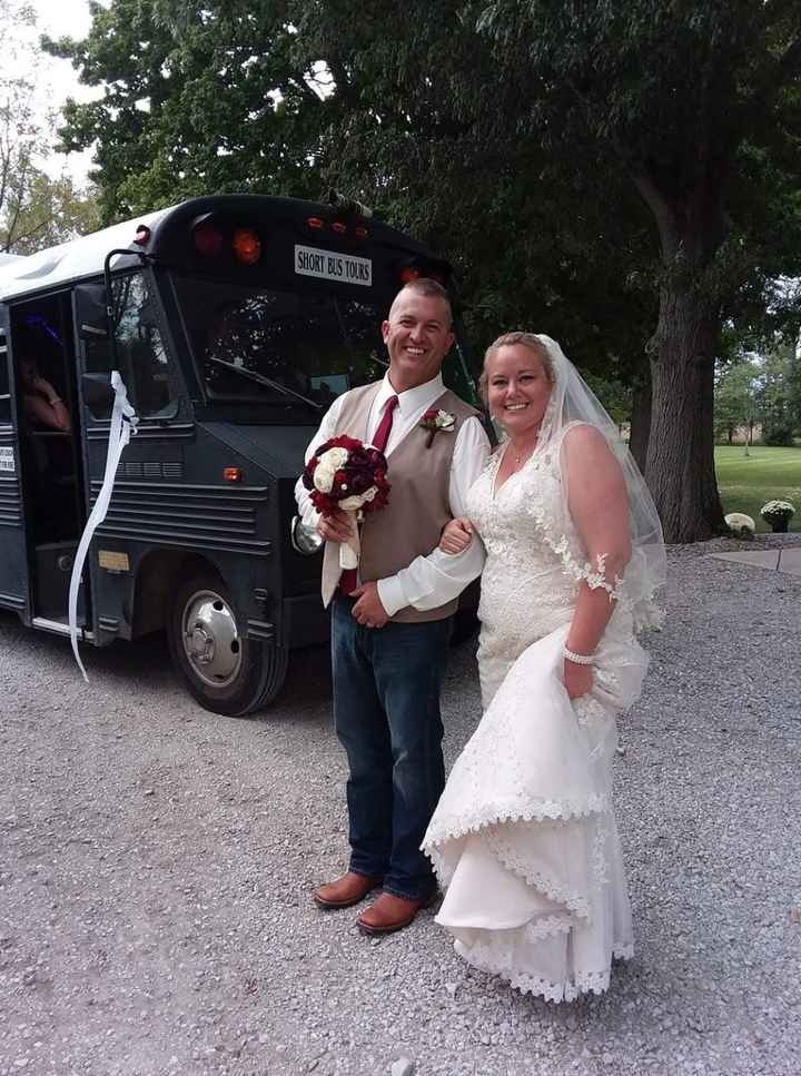 Mr. & Mrs. in front of our party bus to the reception